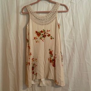 Fits more like a S or M Roomy! Long tank